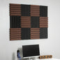 Acoustic foam panels on a wall above a computer setup