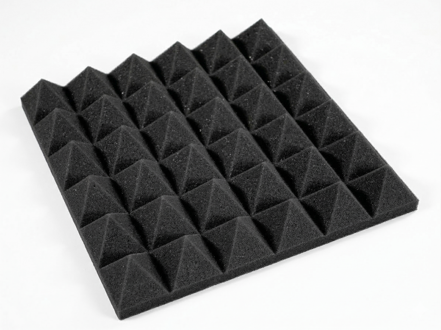 Black pyramid-shaped acoustic foam panels on a white background