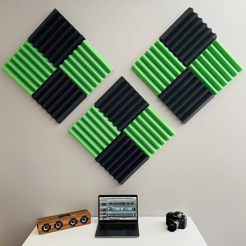 office setup with green and black wedge acoustic foam wall tiles