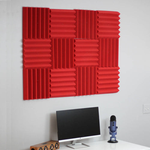 office setup with red wedge acoustic foam wall panels